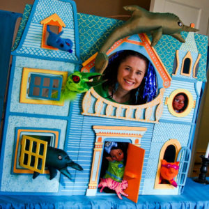 Puppeteer in a blue house set